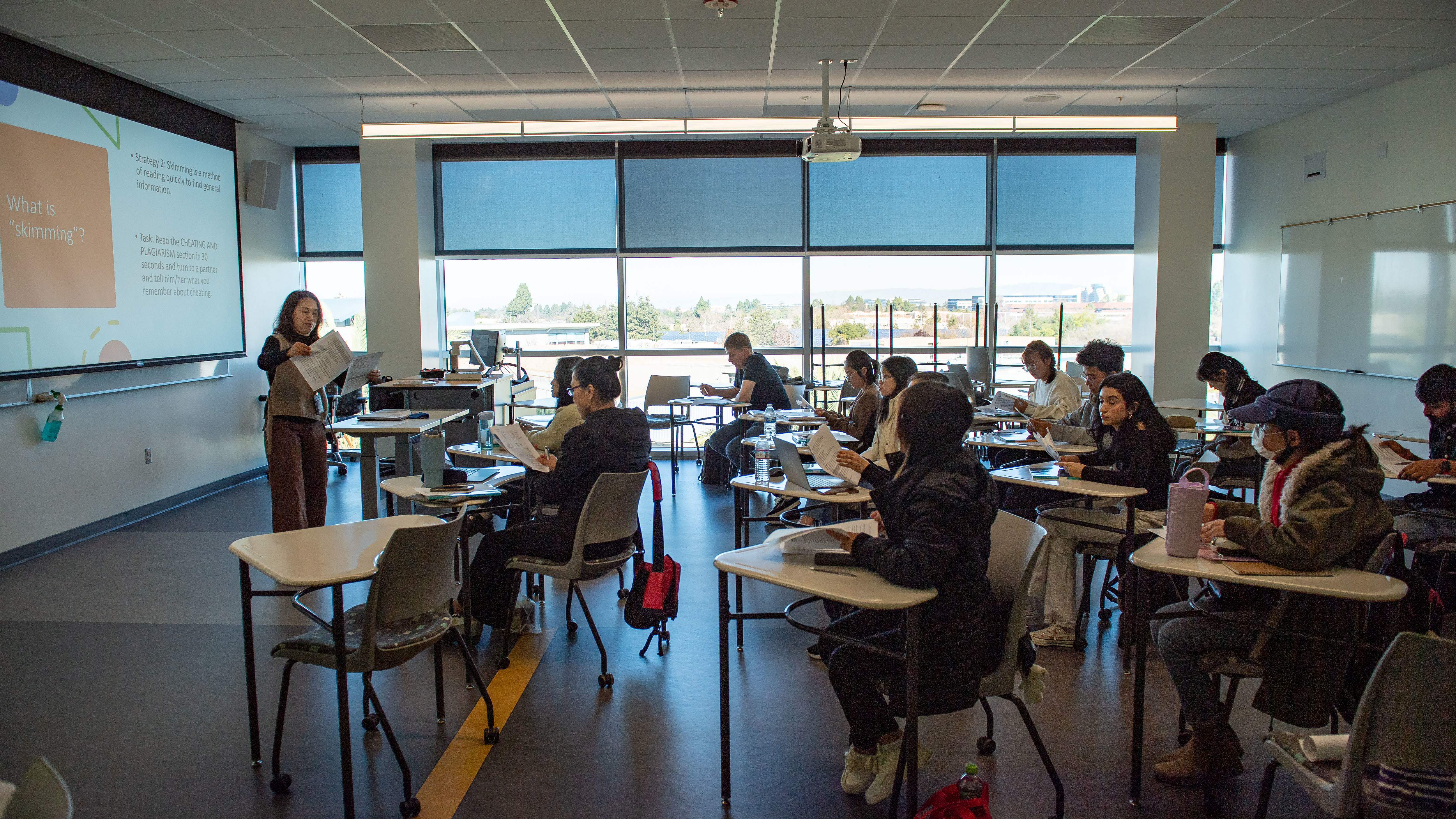Students listening to instructor in class
